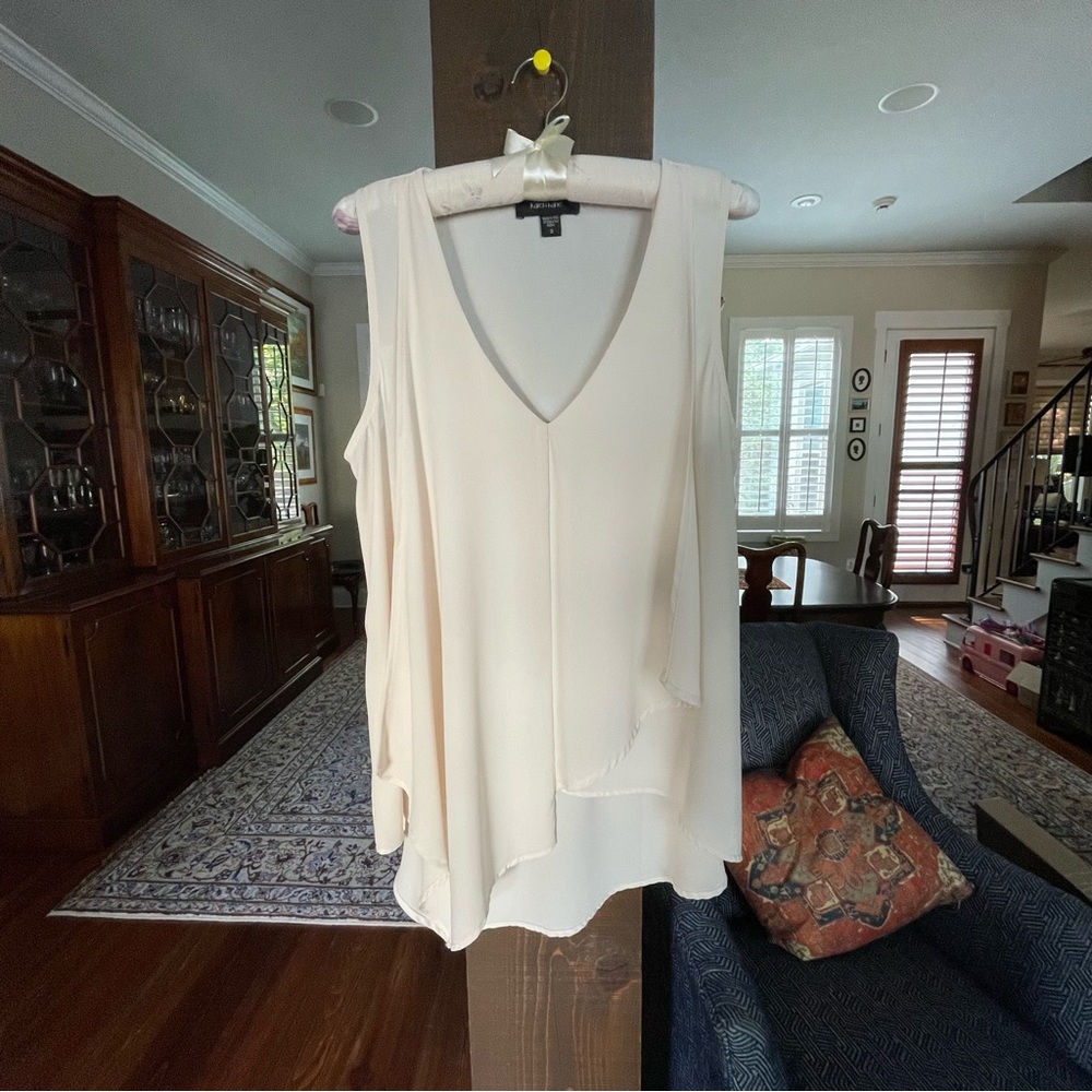 Sleeveless Karen Kane top with Curved deep V neck and front drape.
